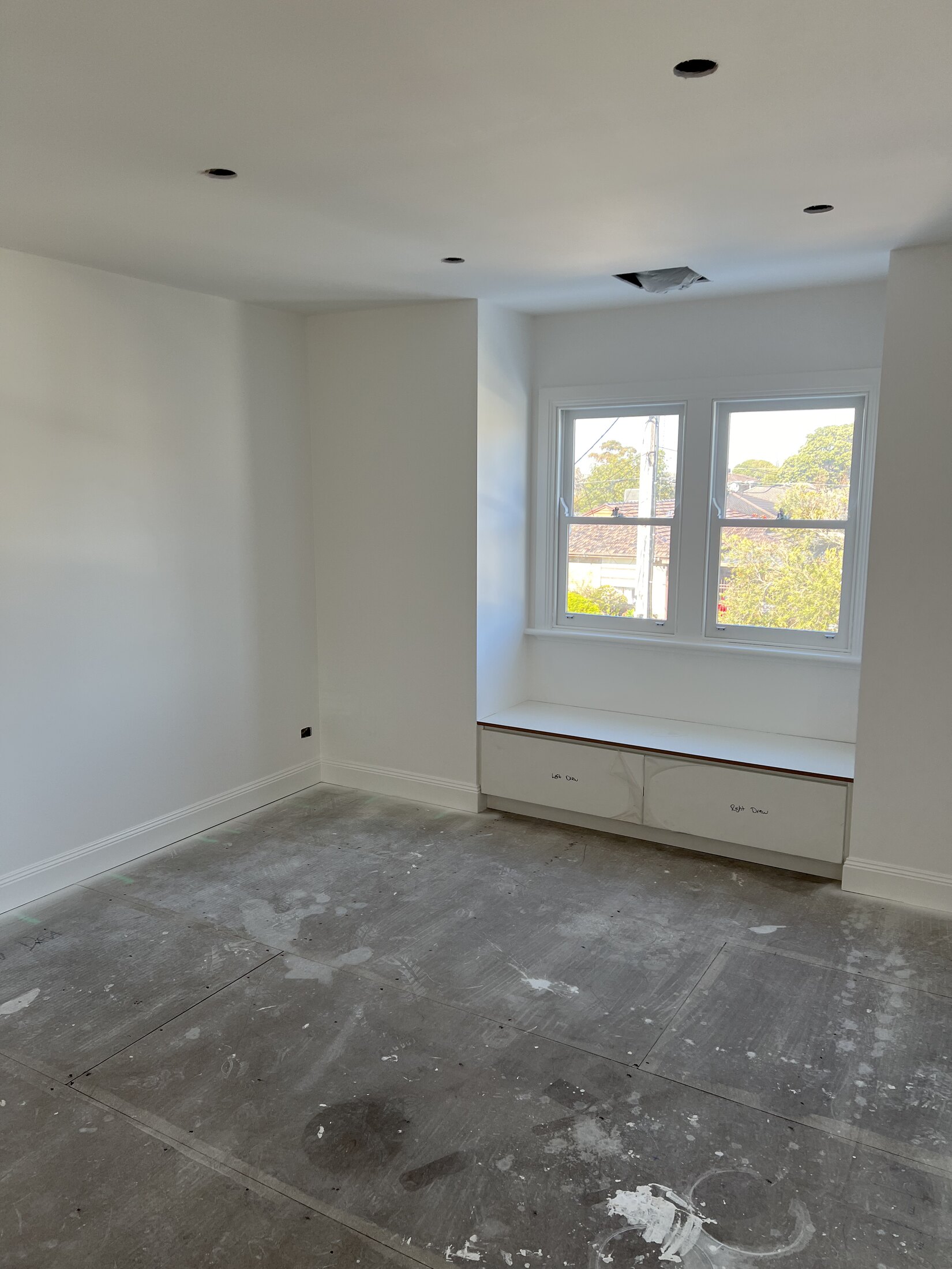 Interior repaint with window seat, trim, and soft natural light