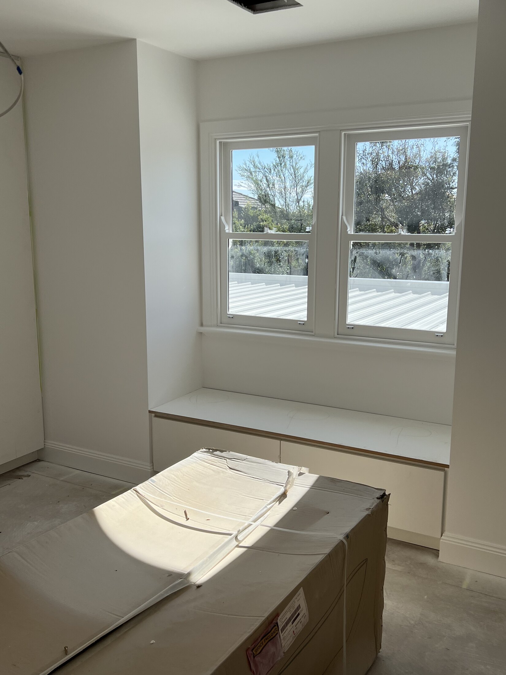 Cabinet doors and joinery prepared for a clean painted finish