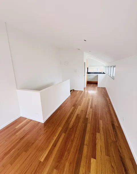 White interior walls beside timber flooring