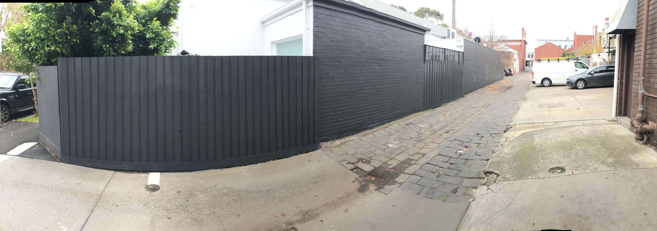 Charcoal boundary fence around a corner property — from our Bayside projects.