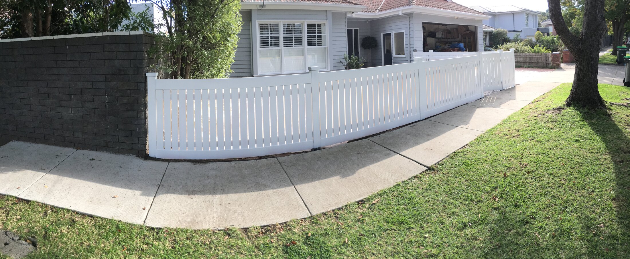 Rear exterior repaint with fresh white walls and darker trim